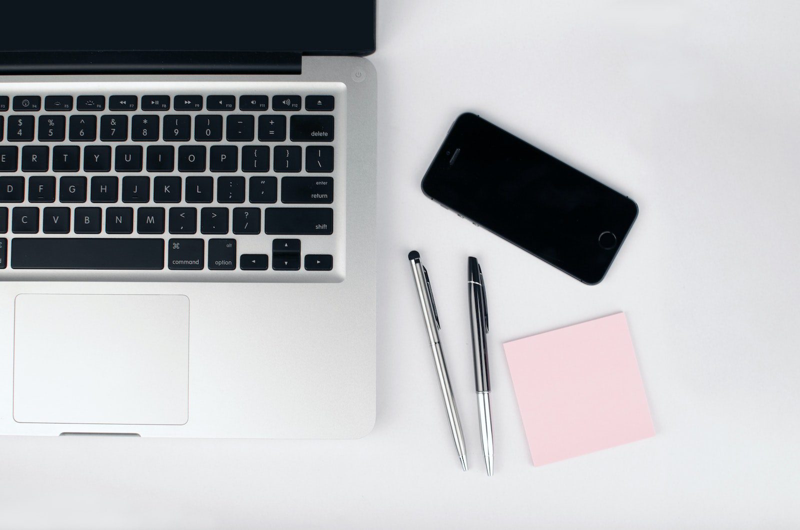 Two Pens Beside Macbook